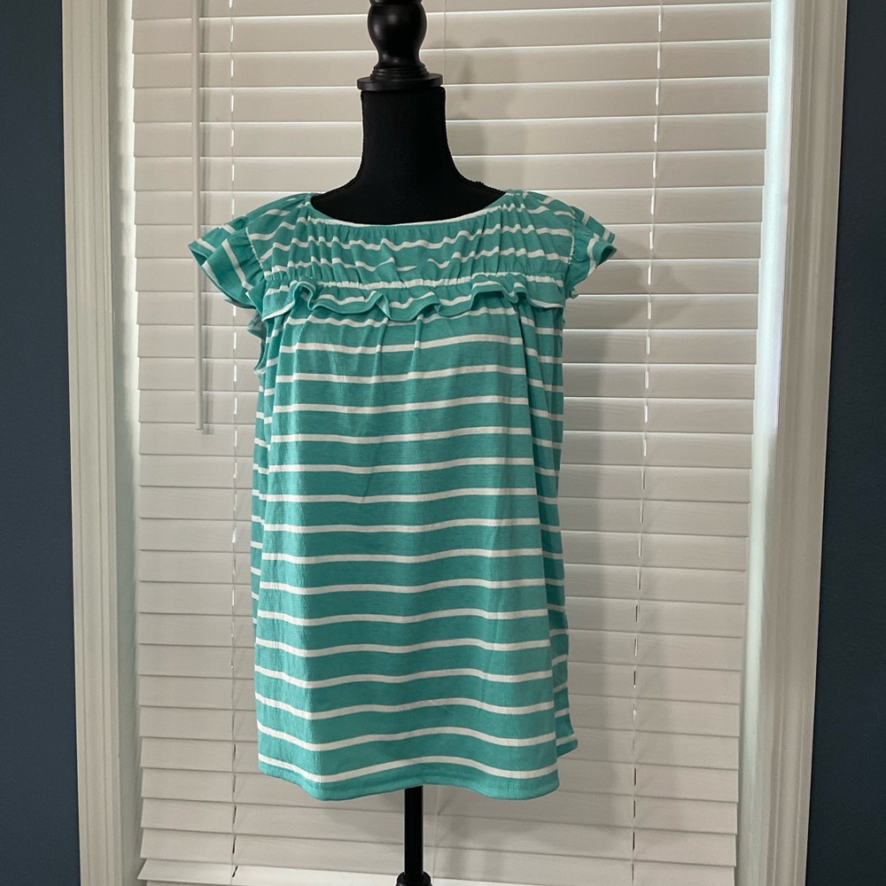 Teal and white striped top.